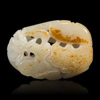 A Chinese White and Russet Jade 'Lotus' Pendant, 18th/19th Century — 清中期 白玉帶皮鏤雕蓮塘荷葉佩