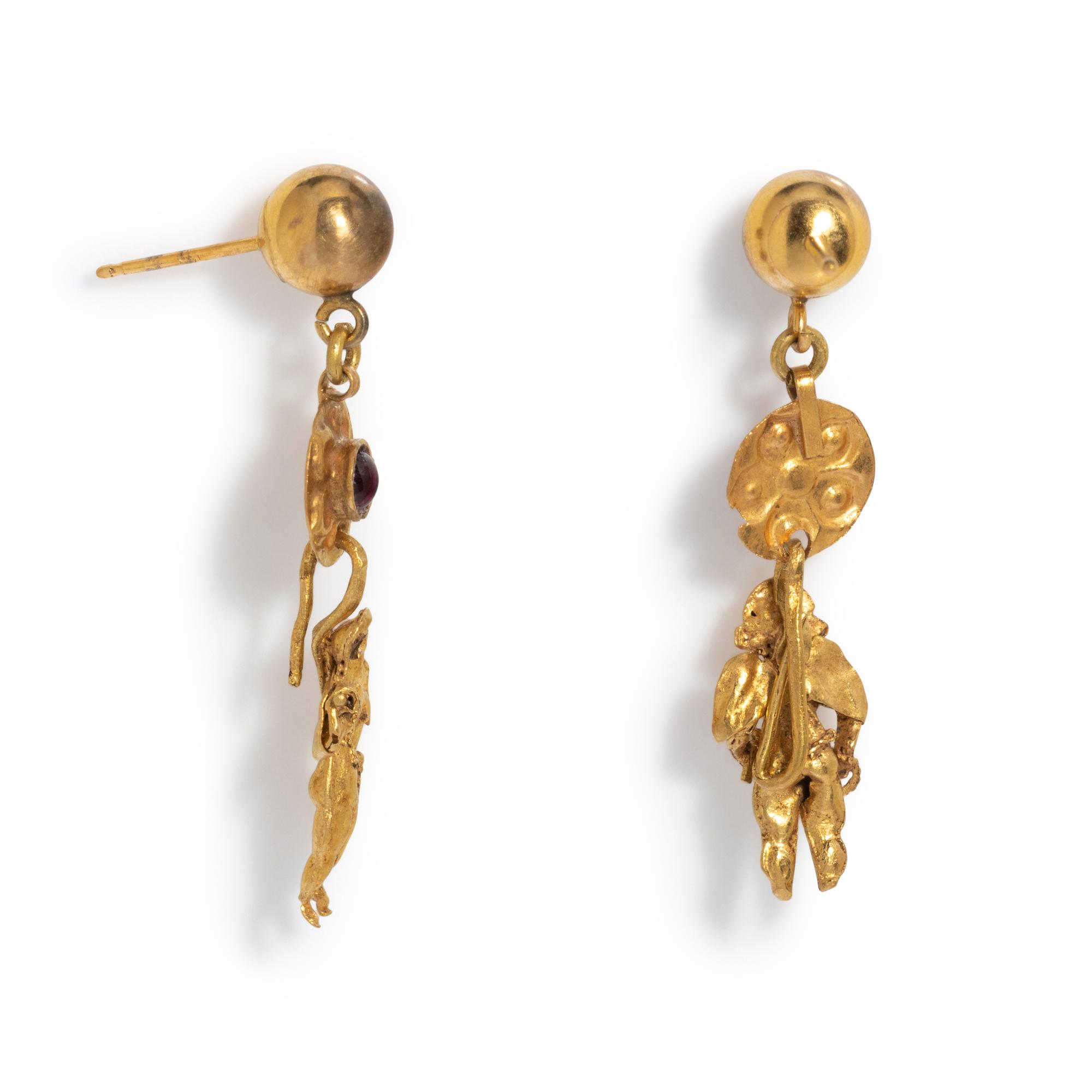 A Pair of Greek Gold and Garnet Earrings with the God Eros