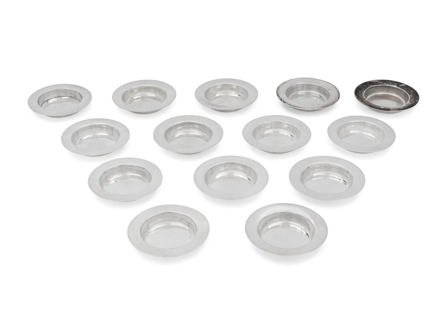A Set of Fourteen English Silver Place-Setting Ash Trays