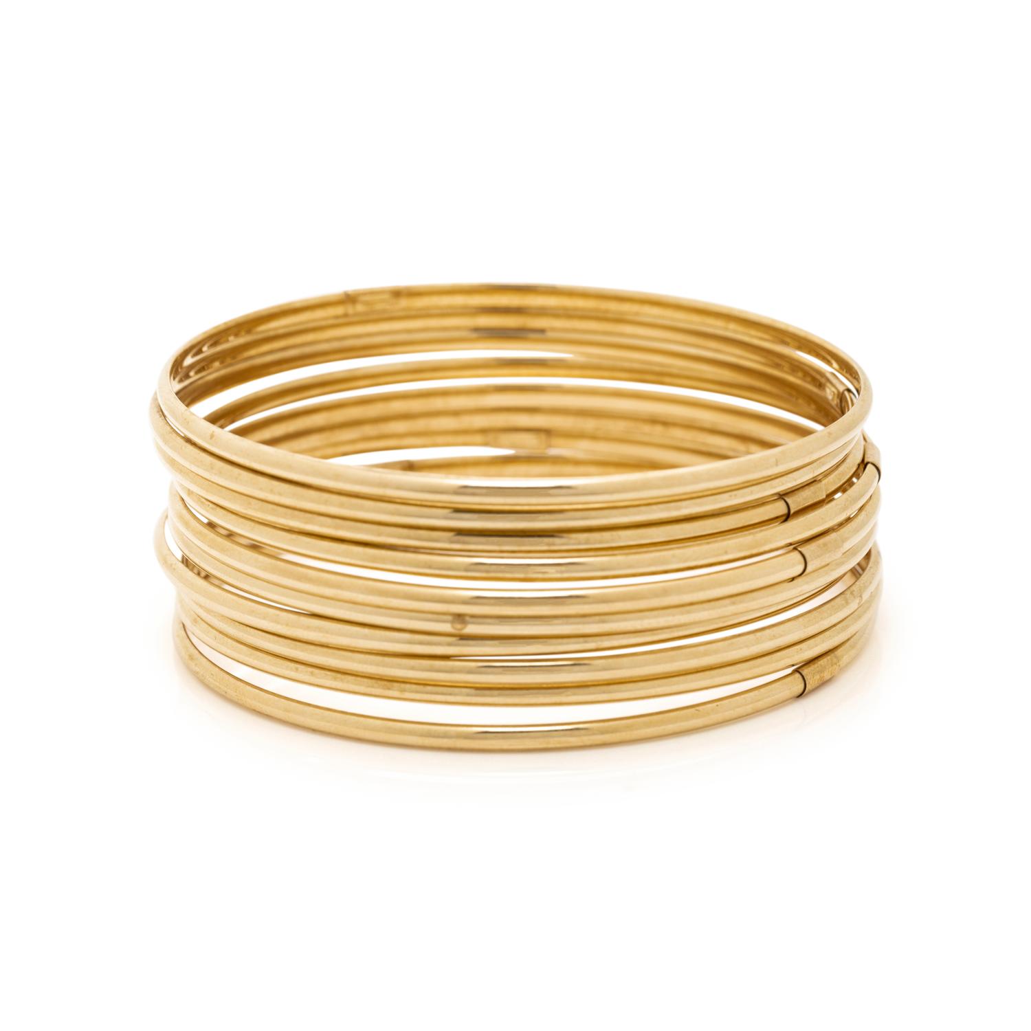 COLLECTION OF YELLOW GOLD BANGLE BRACELETS