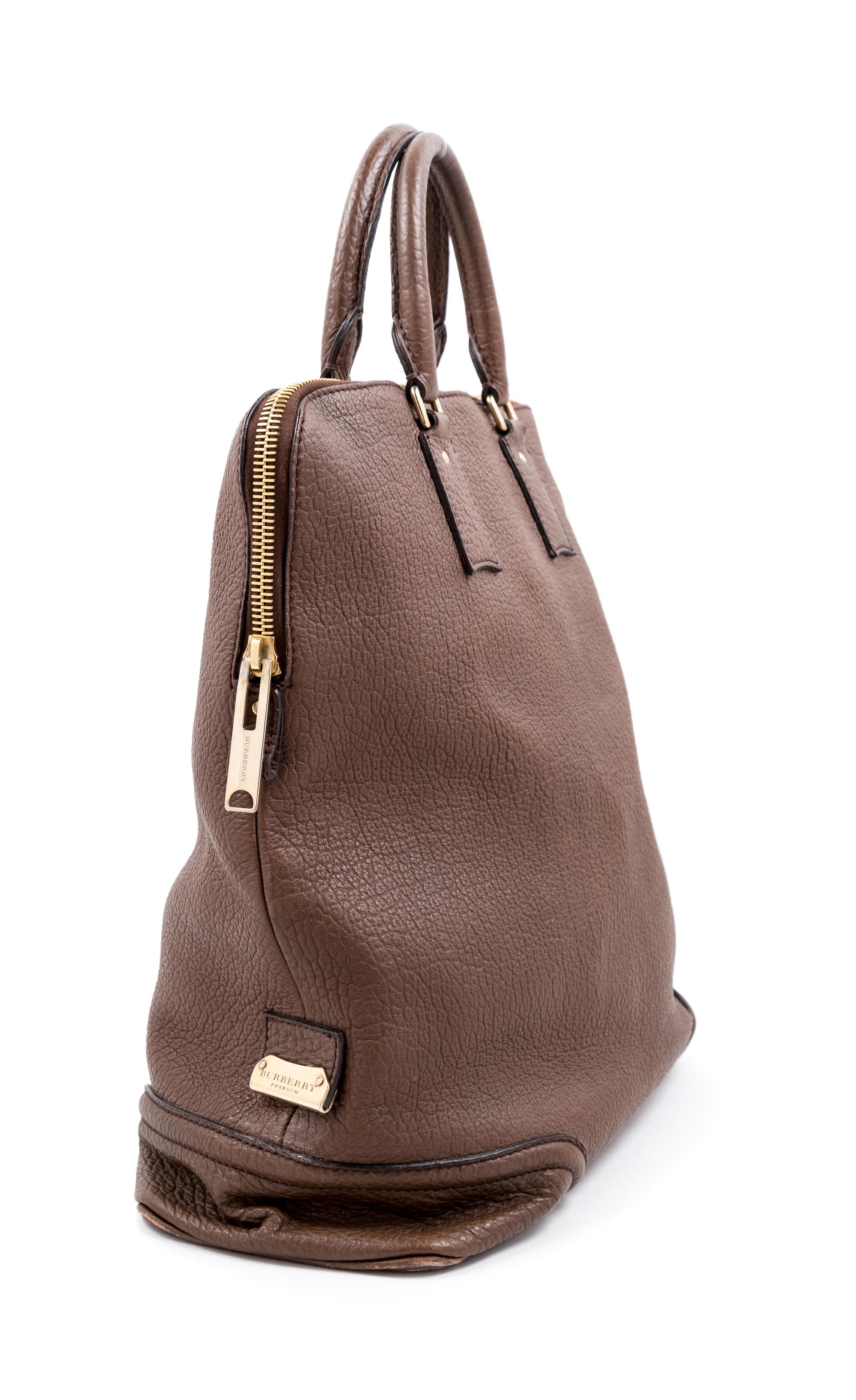 A Burberry Dark Brown Textured Leather Travel Bag, 17" H x 16" W x 6" D; Handle drop: 5".