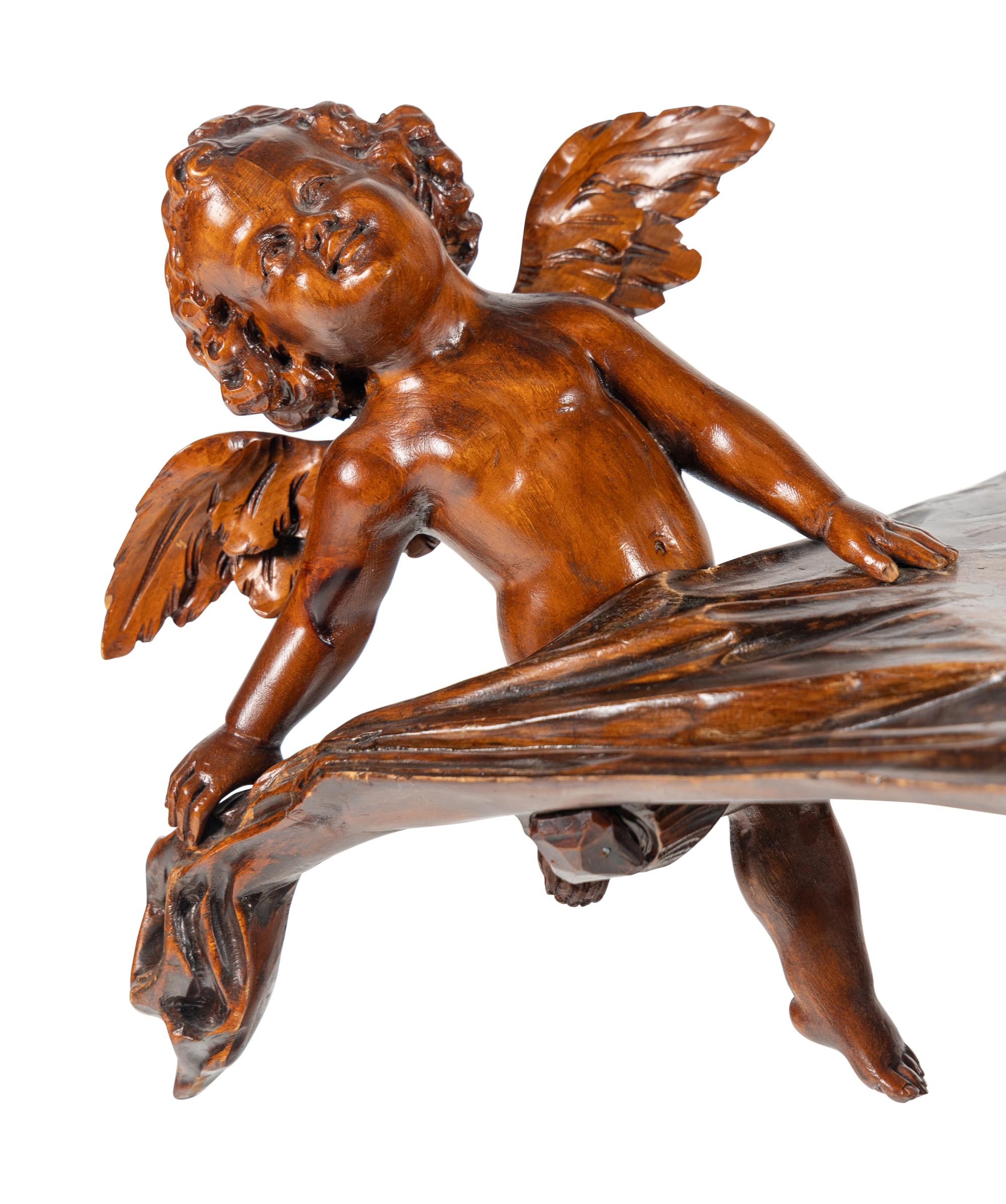 A Venetian Carved Walnut "Fantasy" Table