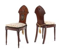 A Pair of Regency Style Mahogany Hall Chairs
