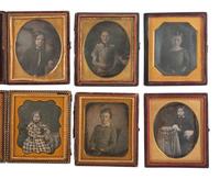 [EARLY PHOTOGRAPHY]. 18 sixth plate daguerreotypes of children with serious or sad expressions.