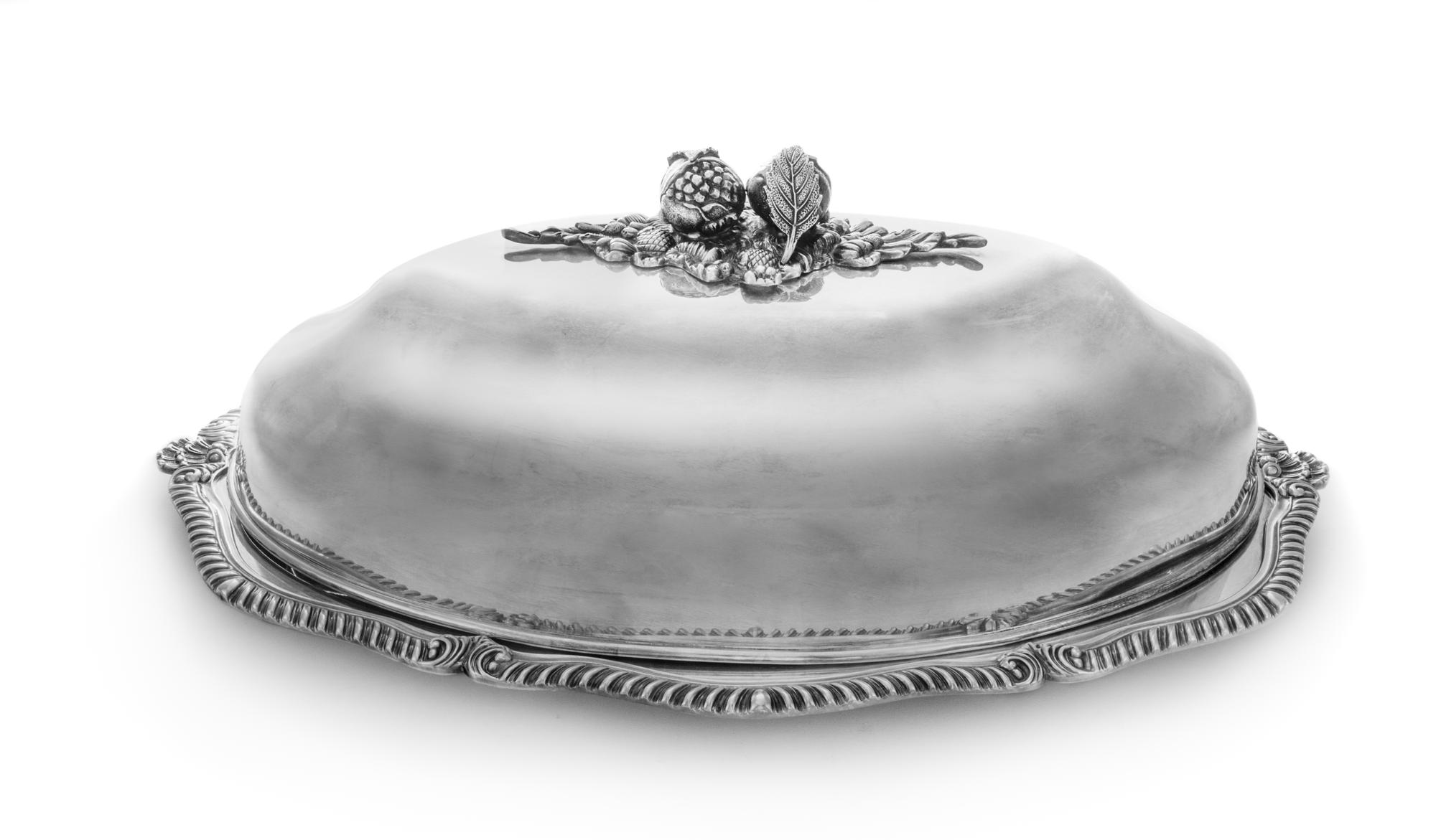 A Silver-Plate Cloche and Tray, Italian, 20th Century, each of oval form, the tray having a gadrooned edge with shell-form ends, the cl