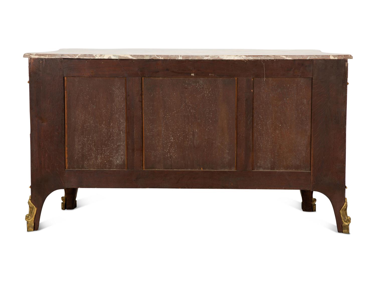 A Louis XVI Style Gilt Bronze Mounted Kingwood and Marquetry Marble-Top Commode
