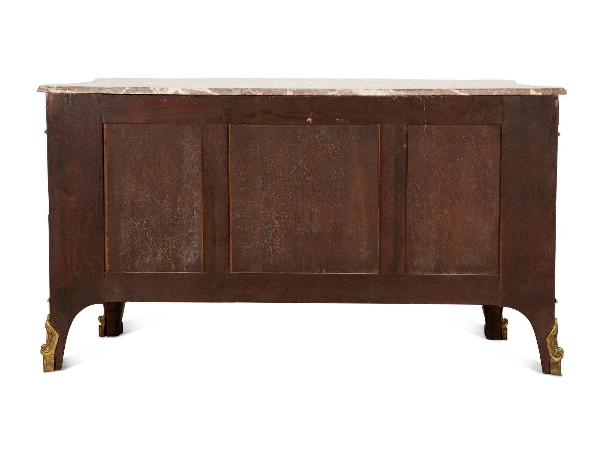 A Louis XVI Style Gilt Bronze Mounted Kingwood and Marquetry Marble-Top Commode