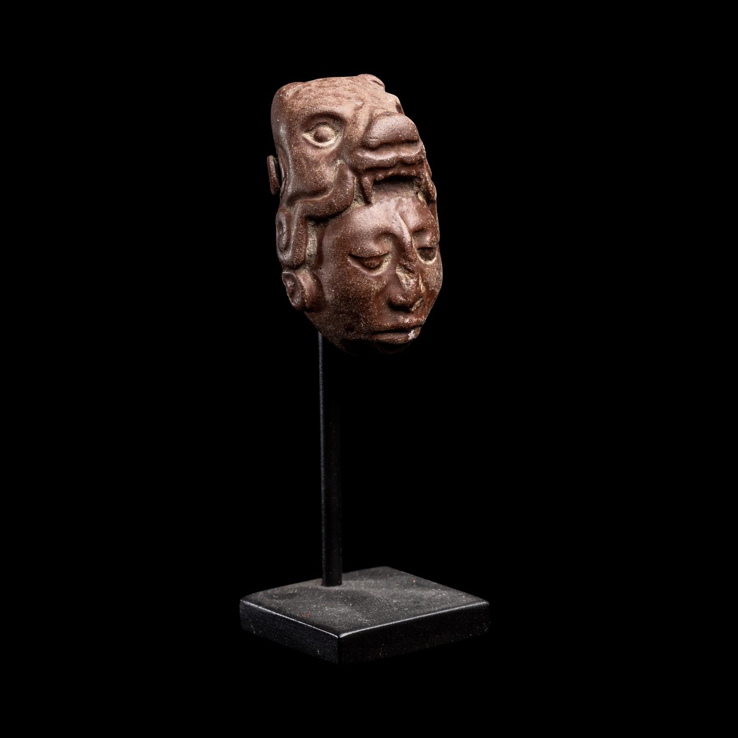 A Maya Stone Head Pendant