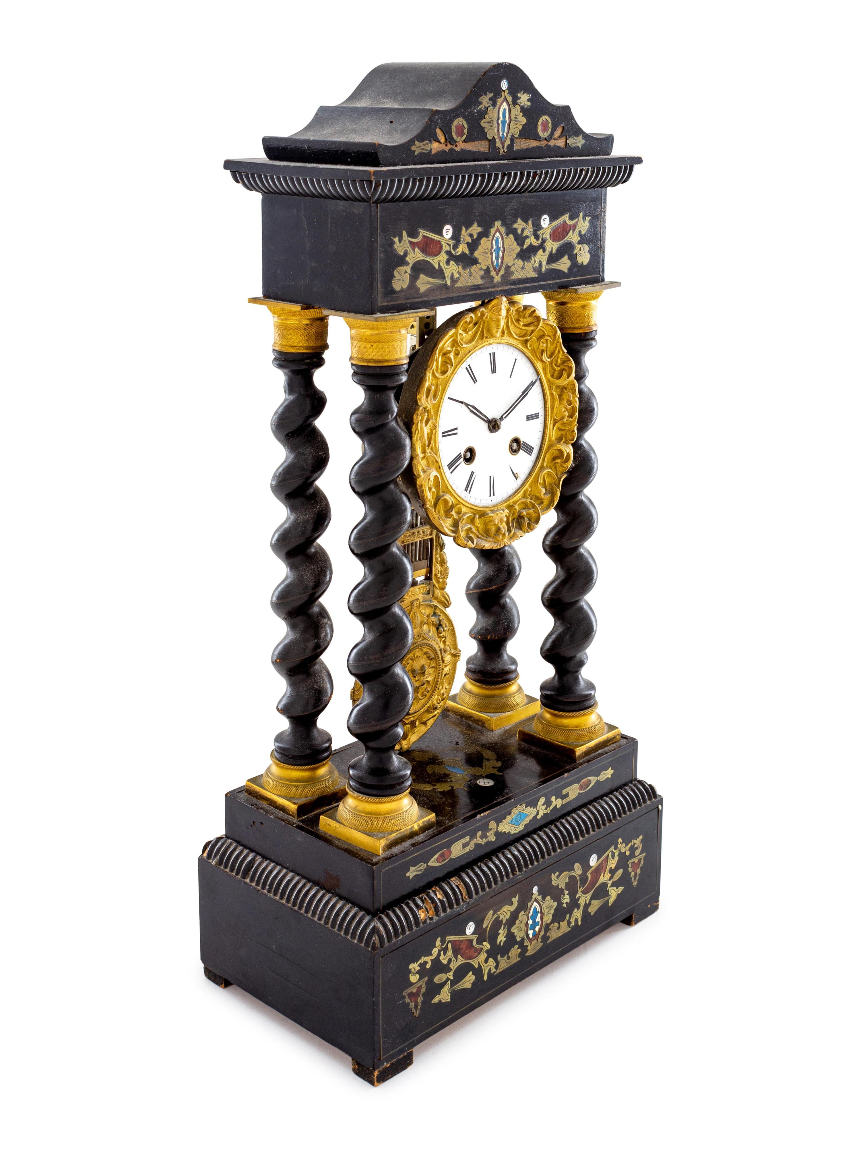A Continental Ebonized and Brass Inlaid Portico Clock