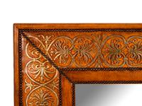 A Gilt Decorated Leather Mirror