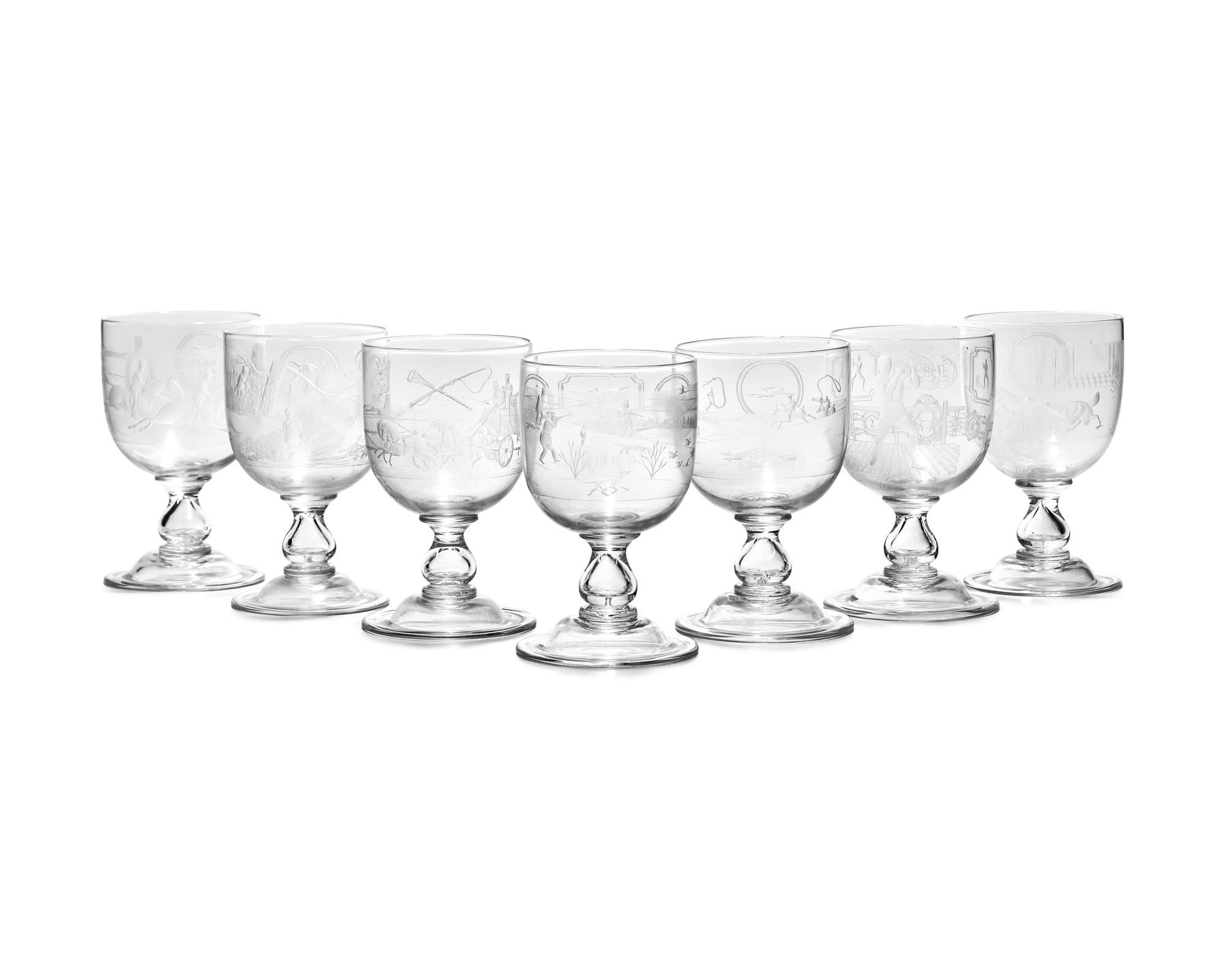 A Set of Seven Blown and Etched Glass Drinking Goblets