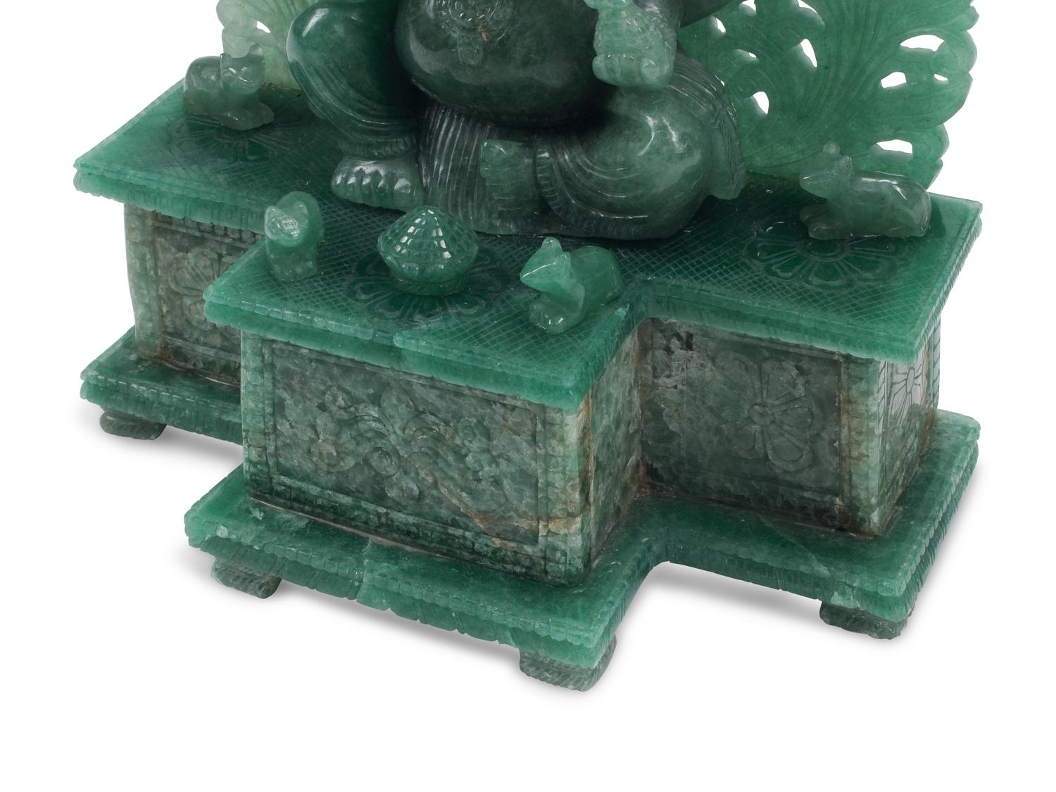 A Carved Green Jasper Figure of a Deity