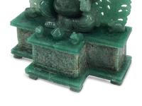 A Carved Green Jasper Figure of a Deity