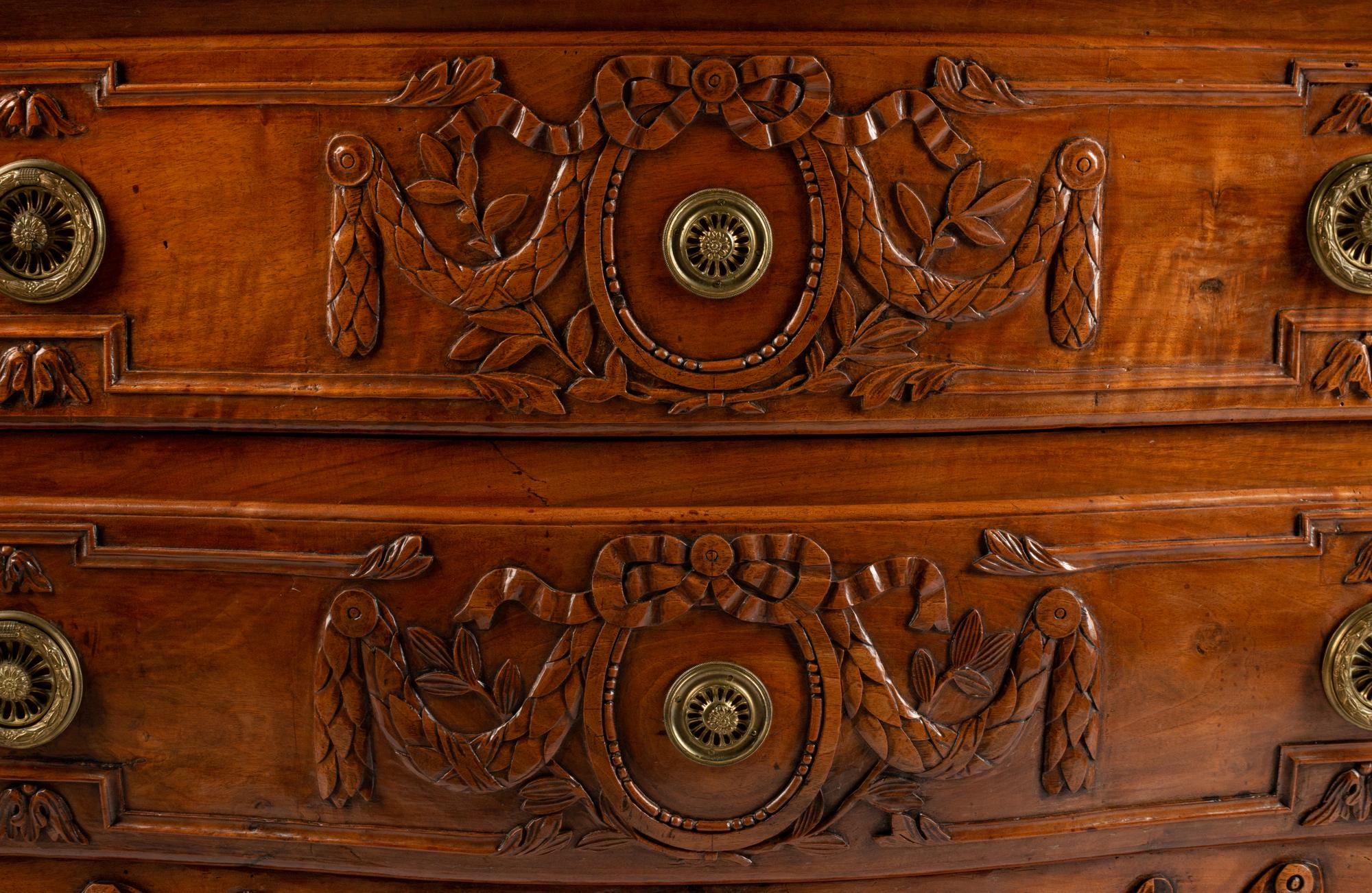 A Louis XV Provincial Carved Walnut Commode — LATE 18TH CENTURY