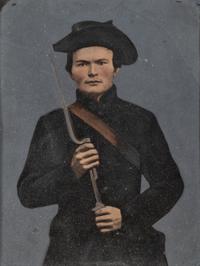 [CIVIL WAR]. Whole plate hand-tinted tintype of a possible Confederate soldier with musket.