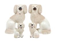A Group of Four Staffordshire Poodles Height of tallest 9 3/4 inches.