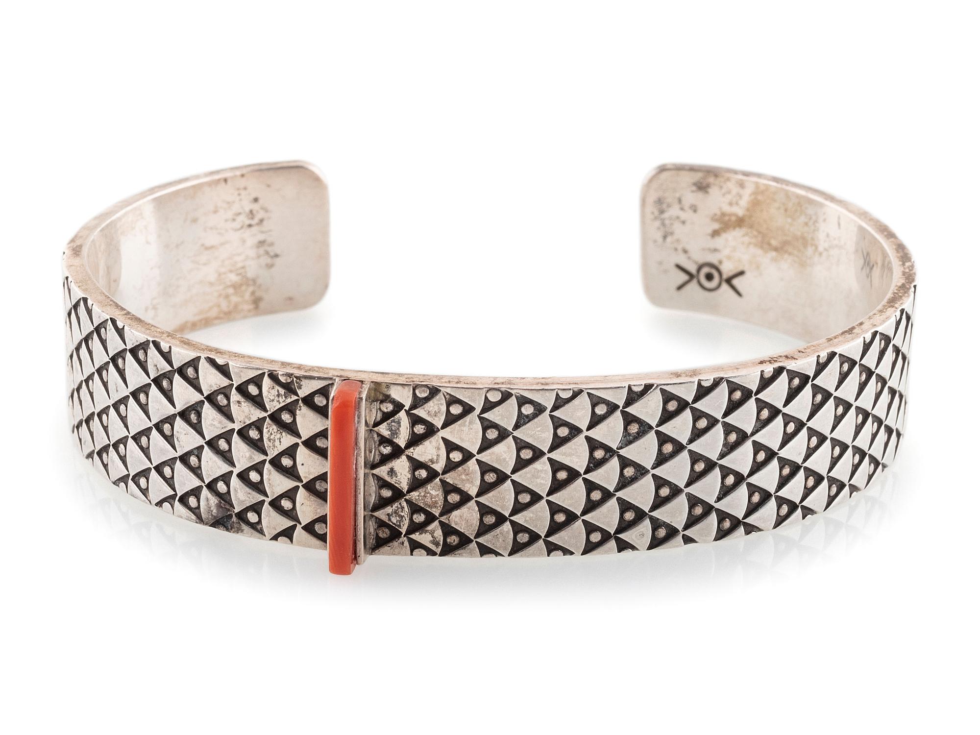 Heavily Stamped Silver Cuff Bracelet, set with a Slender Coral Sliver