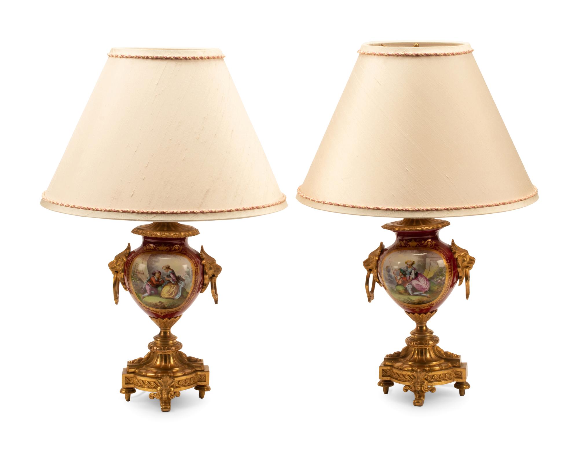 A Pair of Gilt Bronze Mounted Sevres Style Porcelain Lamps