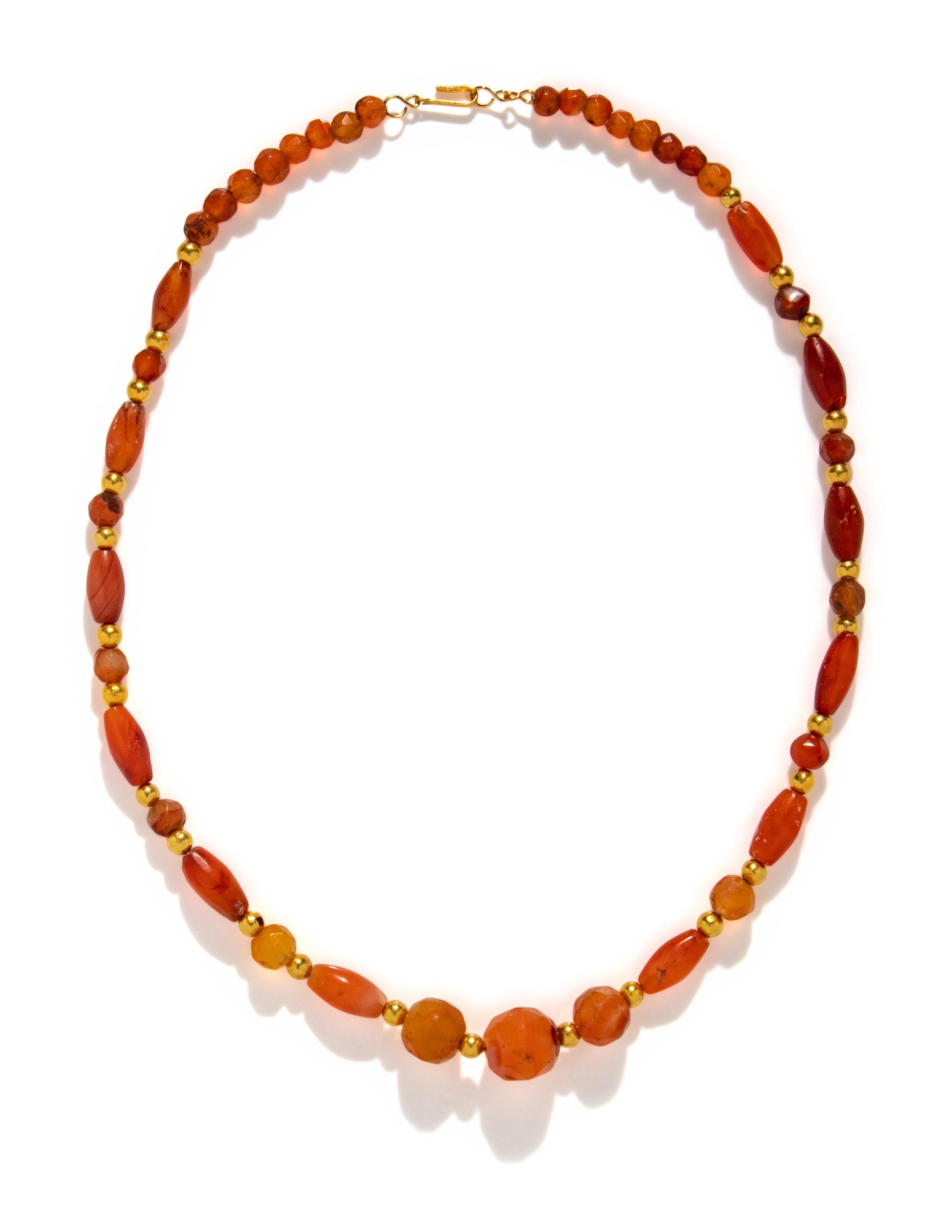 A Near Eastern Gold and Carnelian Bead Necklace