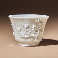 A Chinese Blanc-de-Chine Porcelain Cup, 17th Century — 明末清初 德化白瓷貼塑梅紋花口杯
