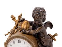 A Louis XV Style Gilt and Patinated Bronze and Marble Figural Mantel Clock