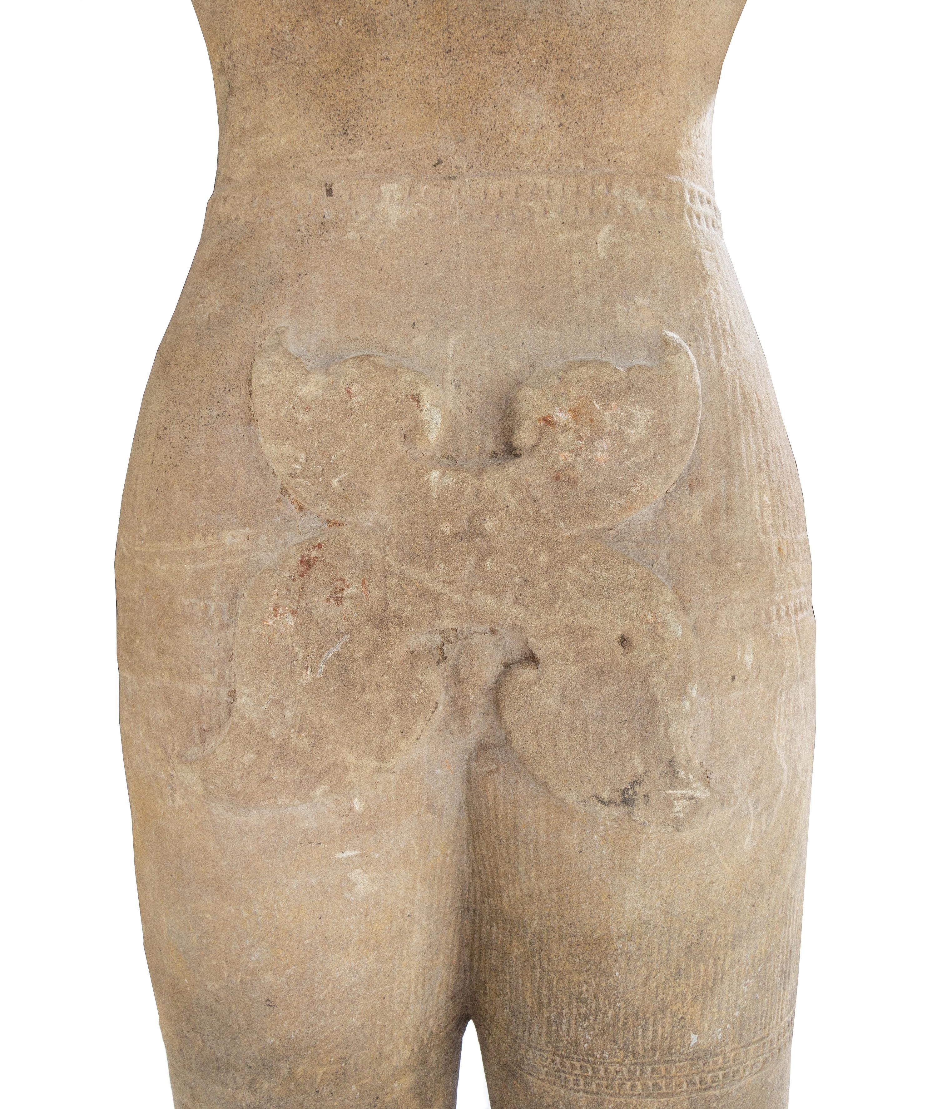 A Khmer Baphuon-Style Limestone Torso of Vishnu Height 43 inches. — ANGKOR WAT STYLE, 11TH CENTURY