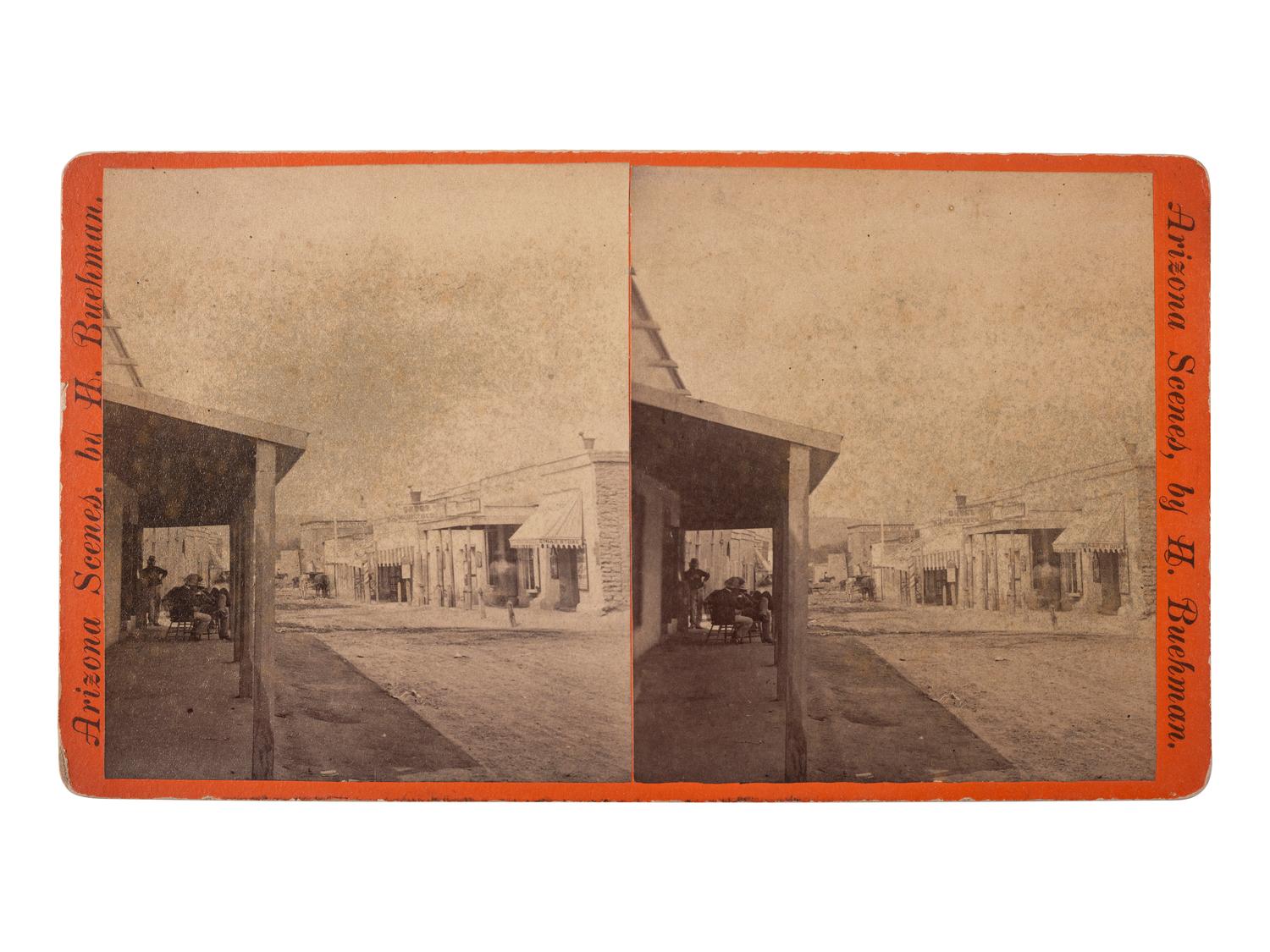 [WESTERN AMERICANA - ARIZONA]. BUEHMAN, Henry (1851-1912), photographer. A group of 2 stereoviews of Tucson, incl. view of Congress Street and horse-drawn ore cart passing through town. Tucson, Arizona Territory, ca 1870s.