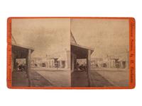 [WESTERN AMERICANA - ARIZONA]. BUEHMAN, Henry (1851-1912), photographer. A group of 2 stereoviews of Tucson, incl. view of Congress Street and horse-drawn ore cart passing through town. Tucson, Arizona Territory, ca 1870s.