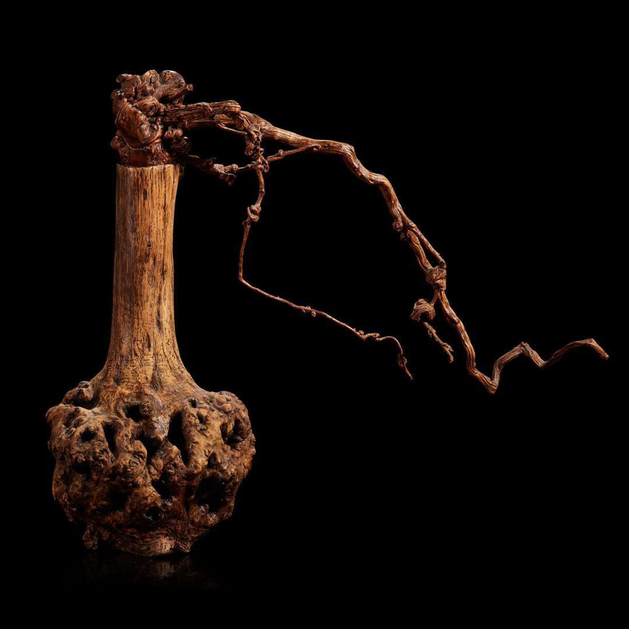 A Burl Wood Vase of "Flowers"