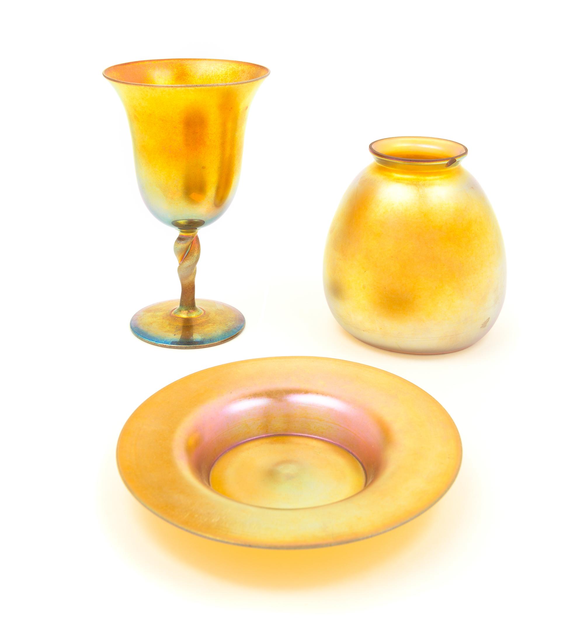 Steuben, EARLY 20TH CENTURY, a group of three gold Aurene glass articles, comprising a goblet, dish and shade