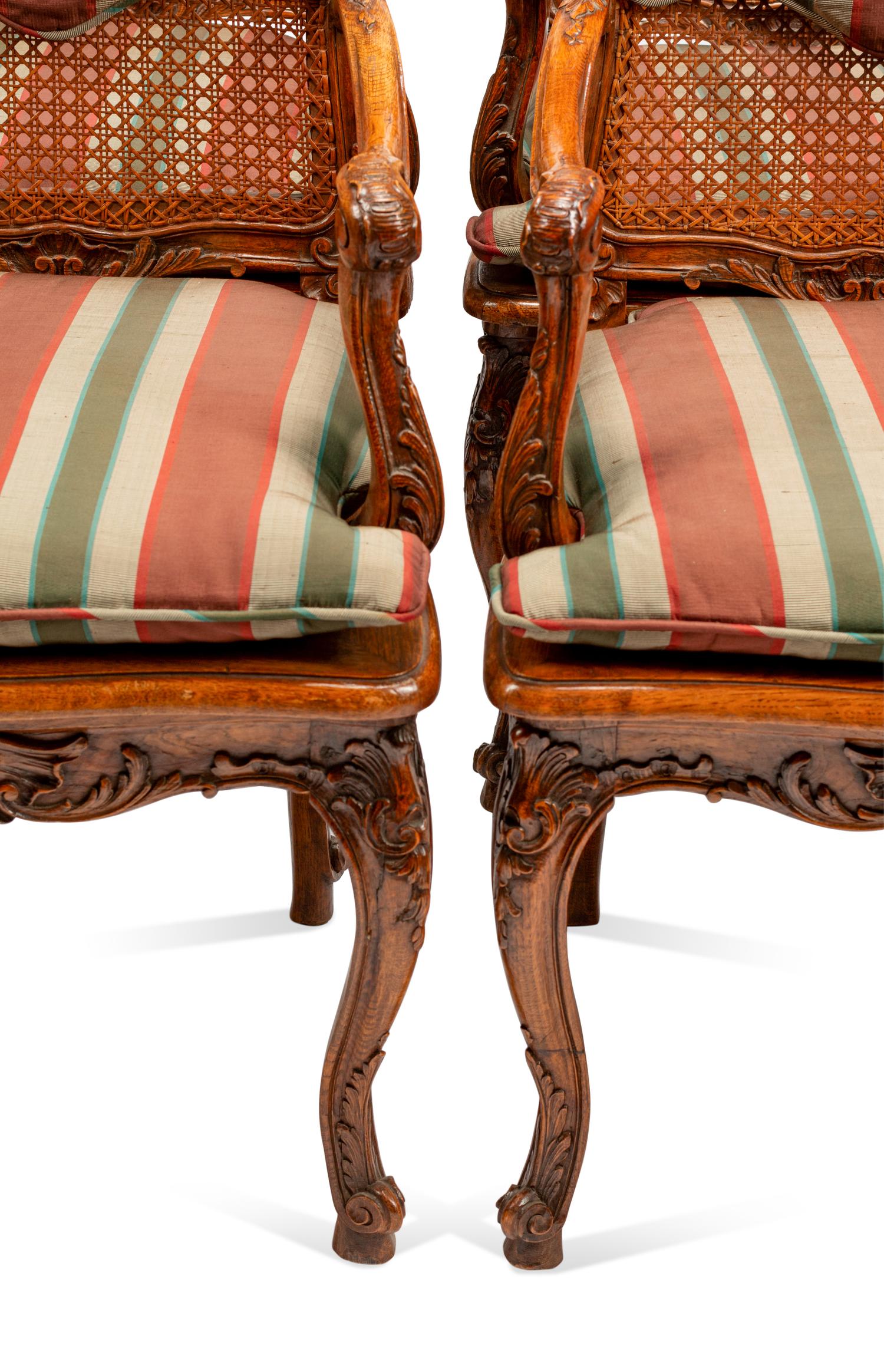 A Set of Eight Louis XV Style Carved Walnut Dining Chairs