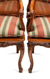 A Set of Eight Louis XV Style Carved Walnut Dining Chairs