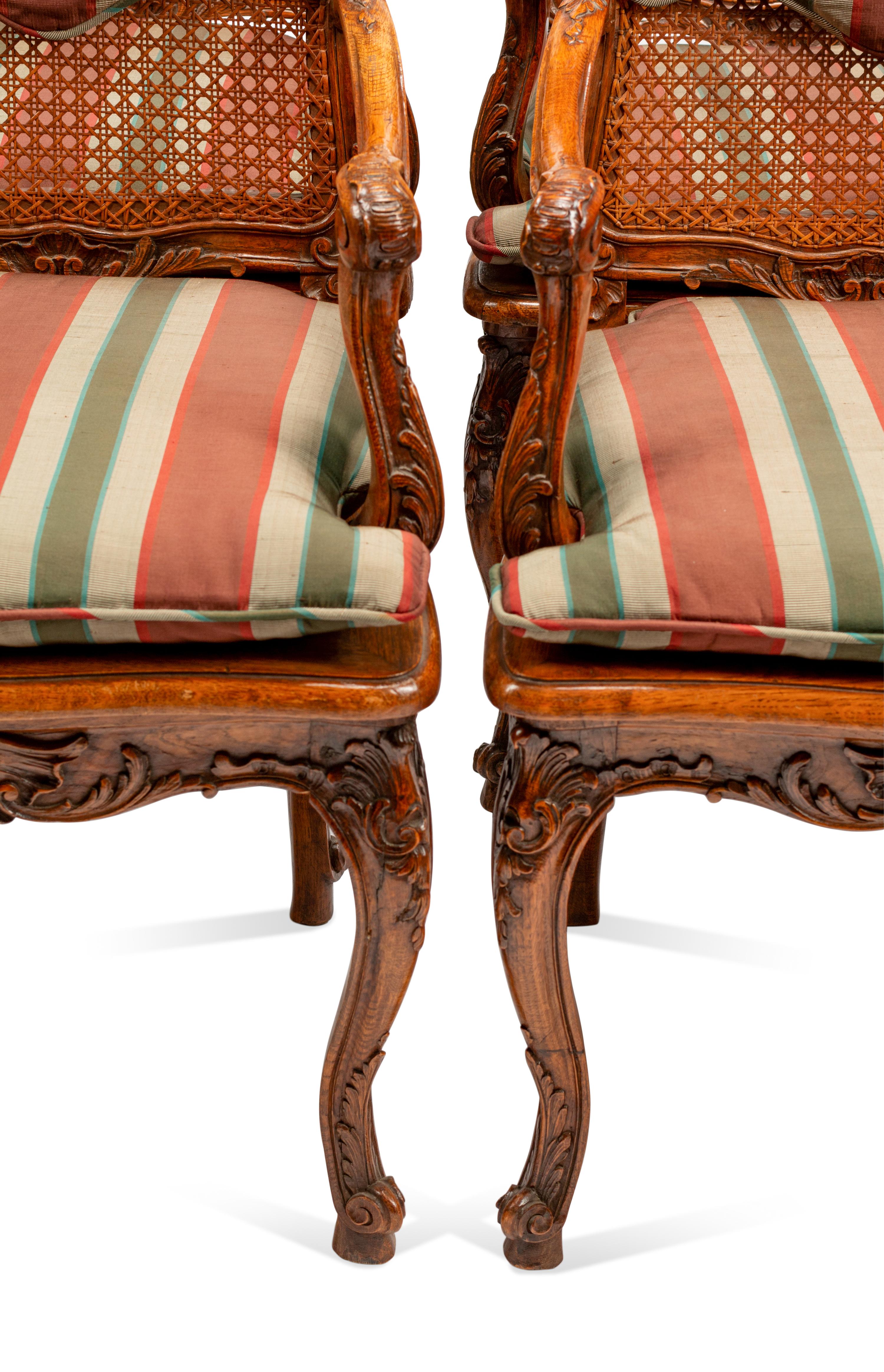 A Set of Eight Louis XV Style Carved Walnut Dining Chairs
