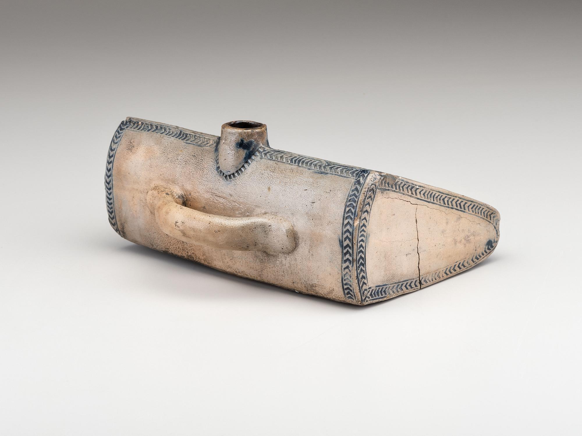 An Early Incised and Cobalt Decorated Stoneware Foot Warmer