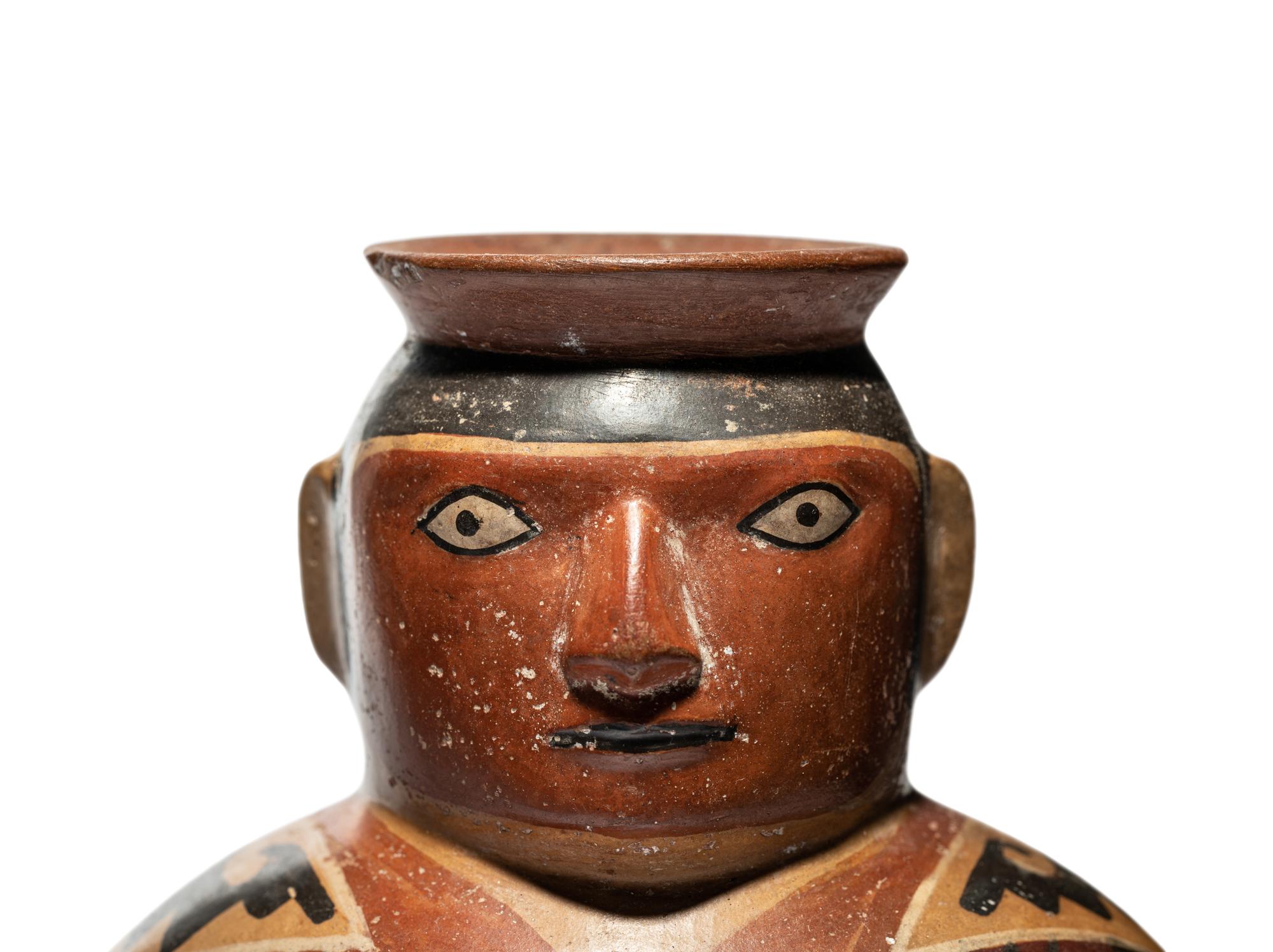 A Huari Man with Poncho Vessel