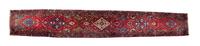 A Persian Wool Runner 19 feet 2 inches x 3 feet 5 inches. — 20TH CENTURY
