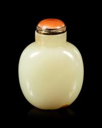 A Carved Russet and Celadon Jade Snuff Bottle