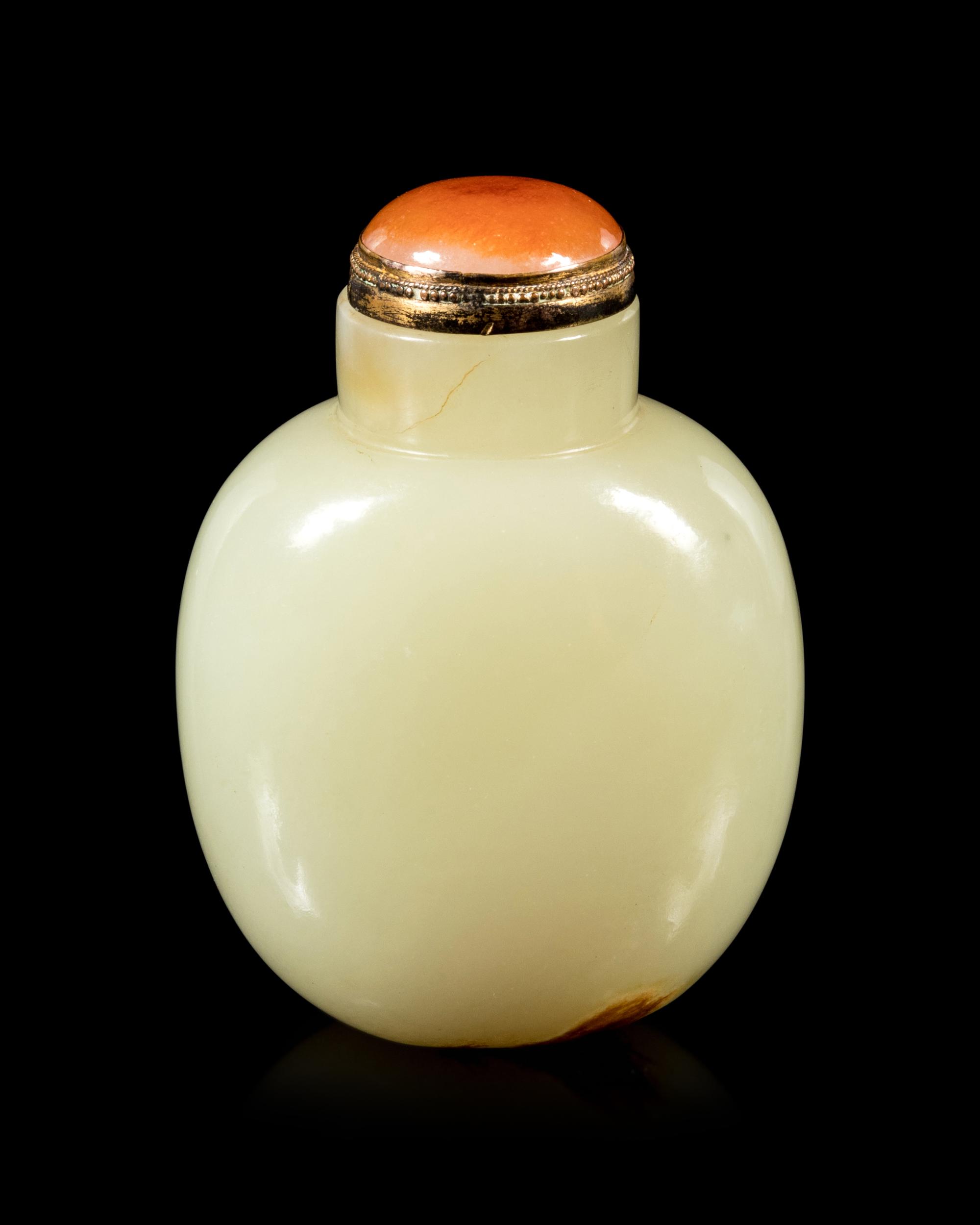 A Carved Russet and Celadon Jade Snuff Bottle
