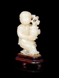 A Chinese Pale Celadon Jade Figure of a Boy