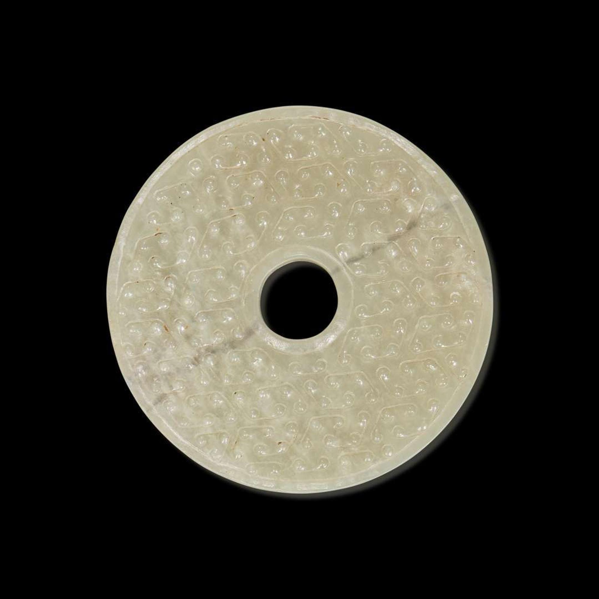 A Chinese greyish white jade archaistic bi disk 灰白玉璧