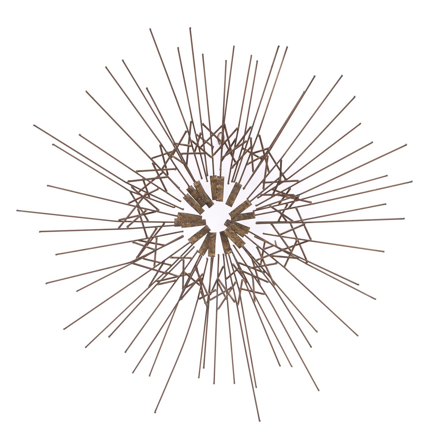 Attributed to Curtis Jere, USA, c.1980, a starburst metal wall sculpture