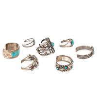 Selection of Navajo, Hopi, and Zuni Silver Bracelets and Earrings, with Inlay