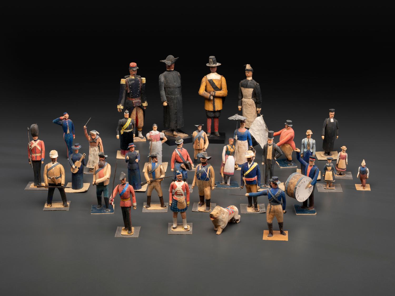 A Collection of Folk Art Carved and Painted 'English Parade' Figures