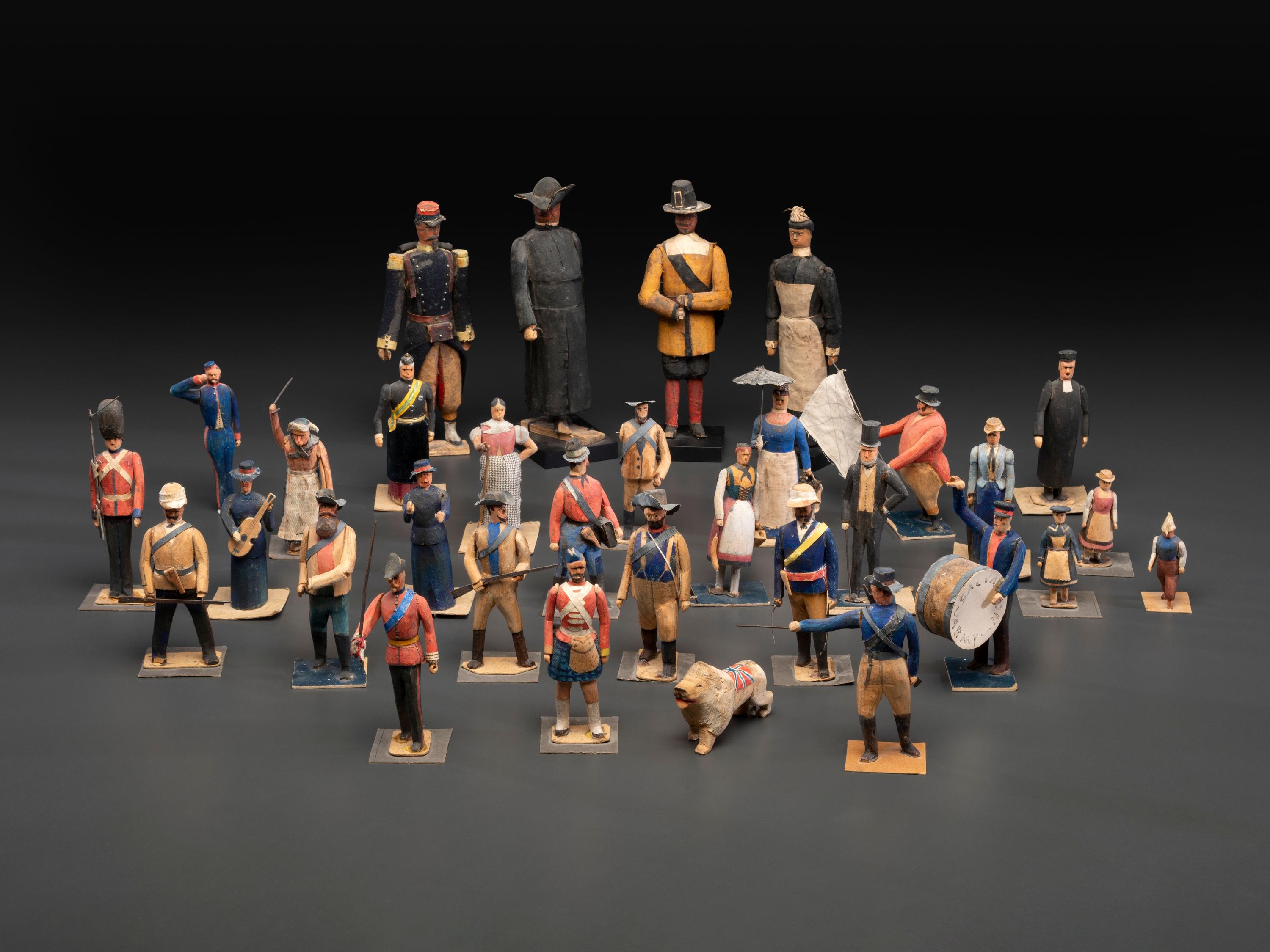A Collection of Folk Art Carved and Painted 'English Parade' Figures