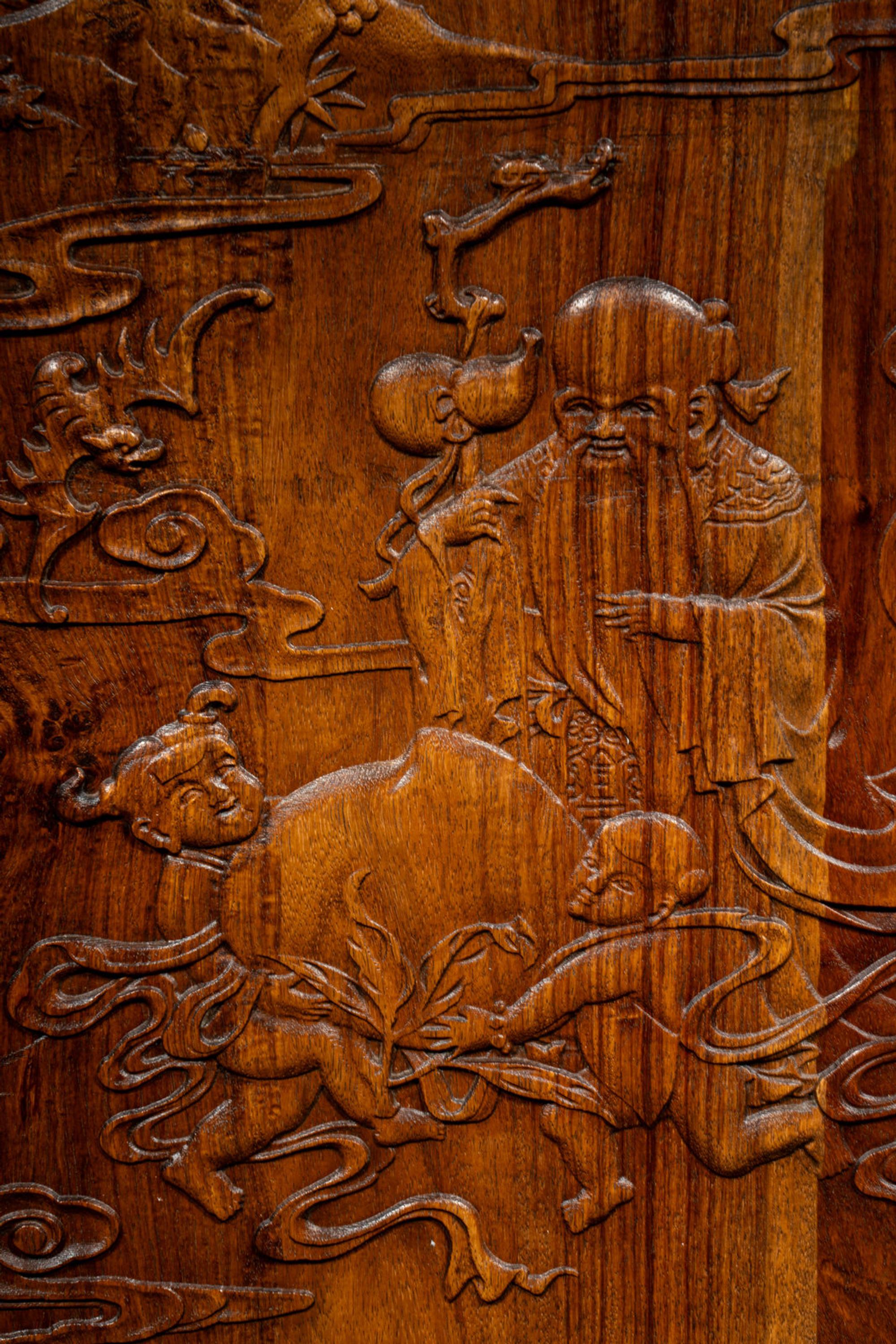 A Set of Three Chinese Huanghuali Couplet Wall Panels