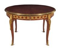 A Louis XVI Style Gilt Bronze Mounted Parquetry Dining Table