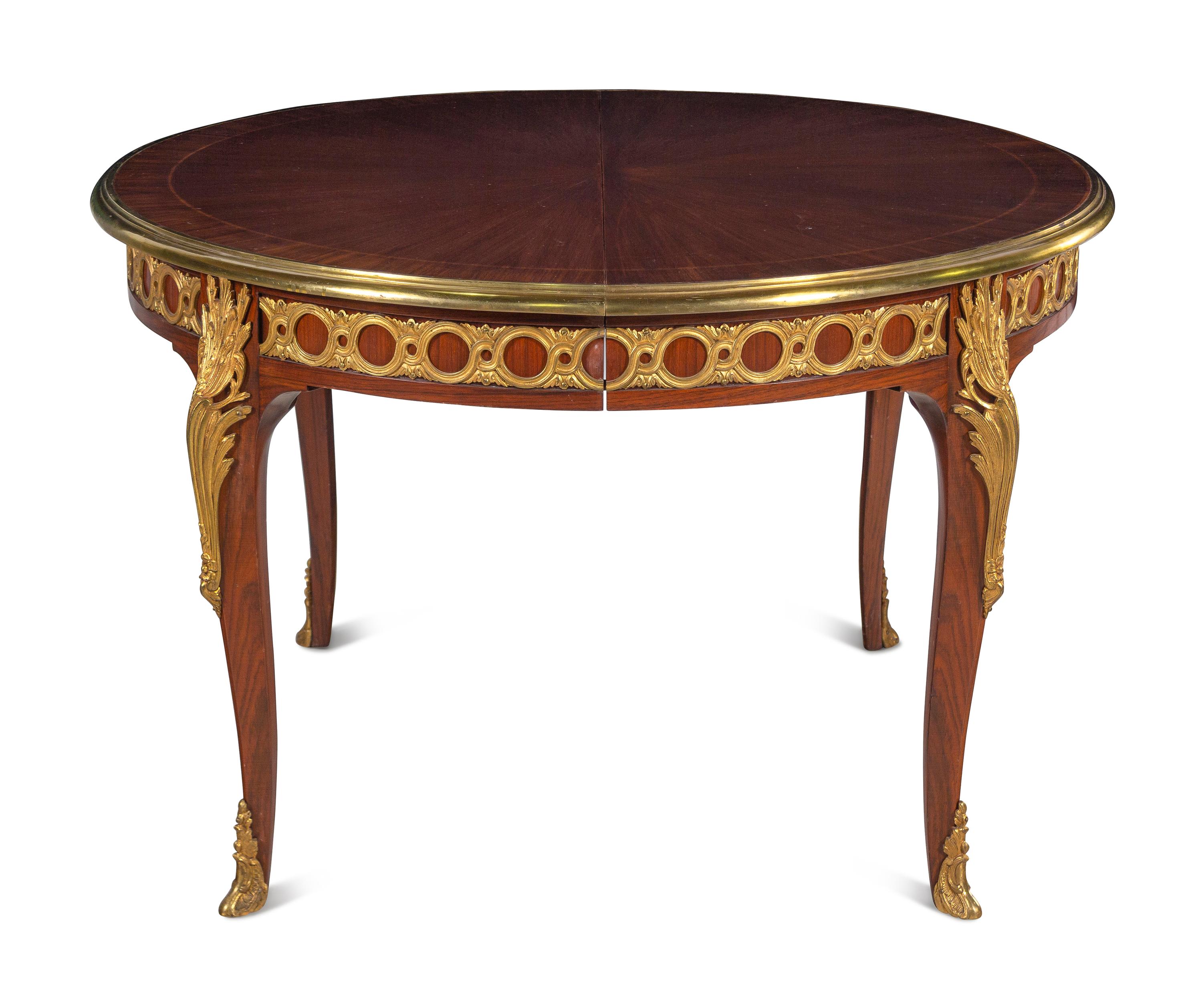 A Louis XVI Style Gilt Bronze Mounted Parquetry Dining Table