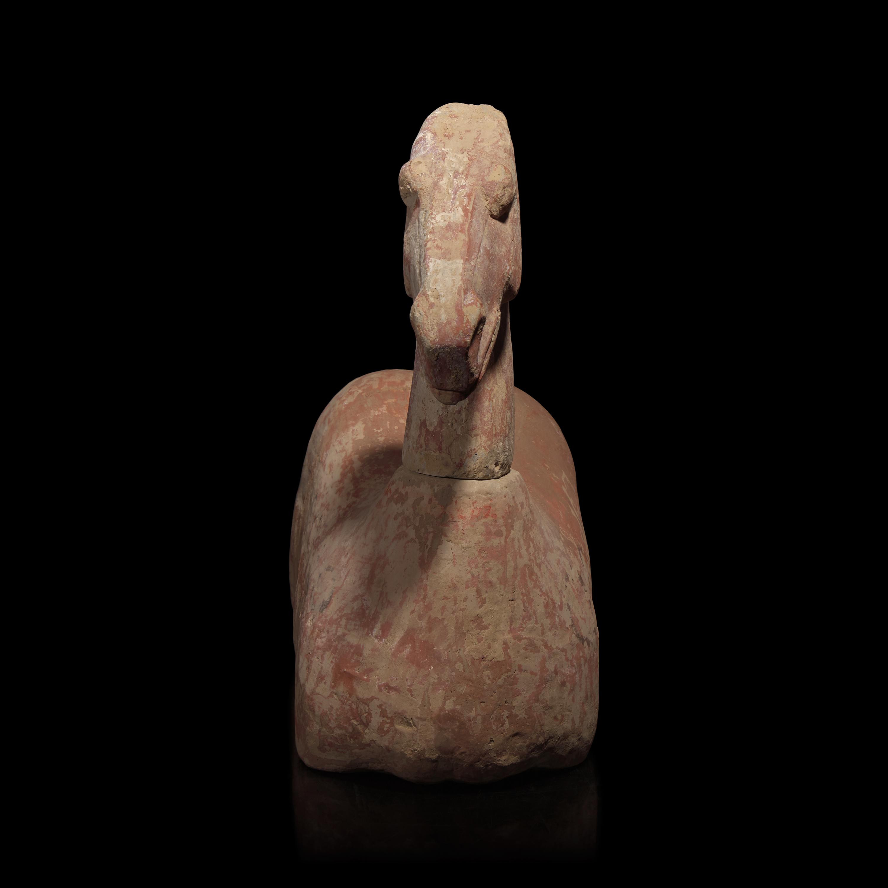 A Chinese Pottery Figure of a Recumbent Horse, Han Dynasty — 漢 彩繪灰陶馬