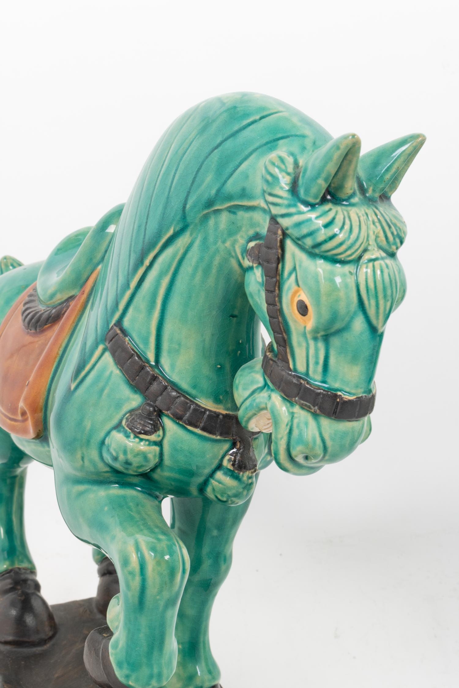 A Pair of Turquoise Glazed Pottery Horses