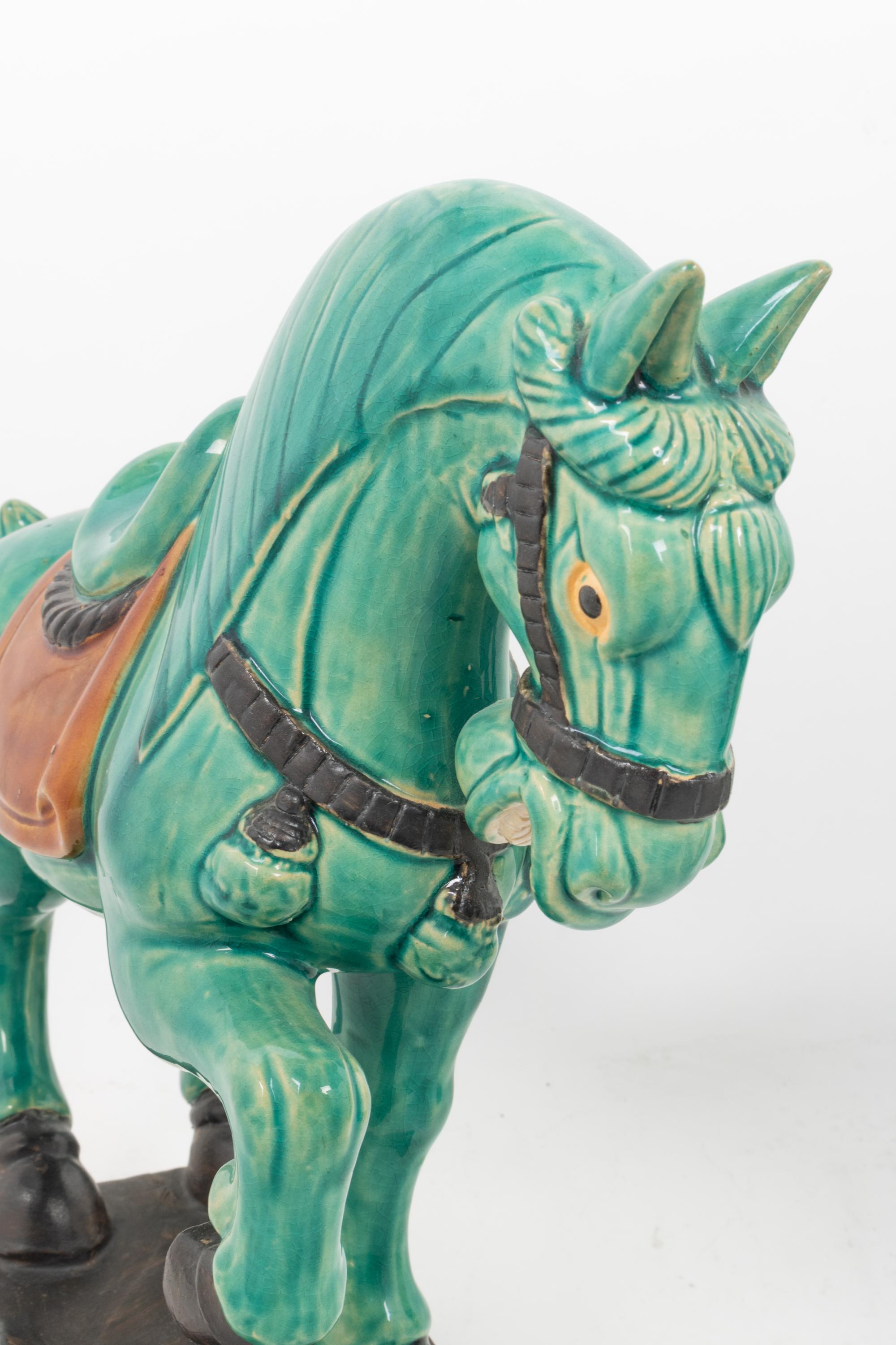 A Pair of Turquoise Glazed Pottery Horses